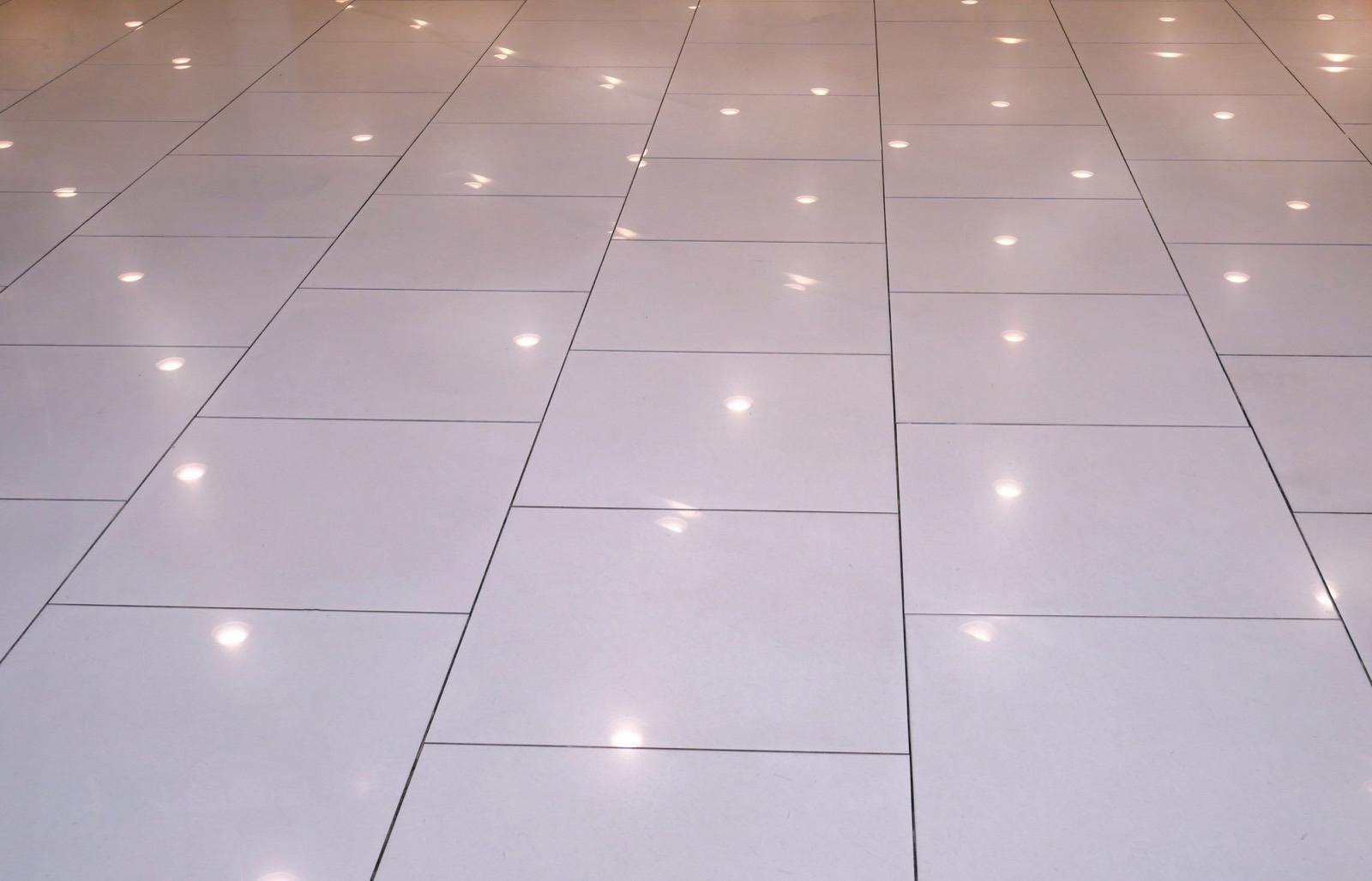Glossy restored tiled floor with light reflection